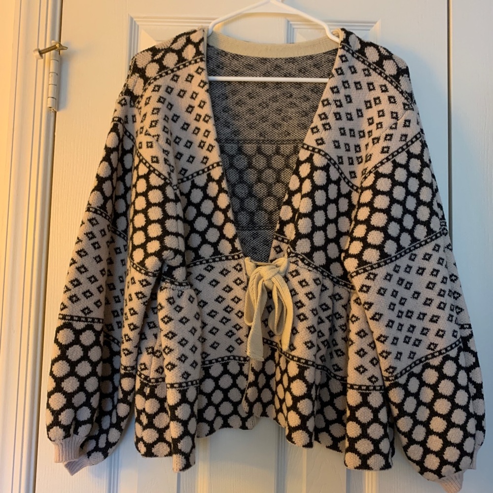 Cardigan *can be worn as a sweater if tied tight